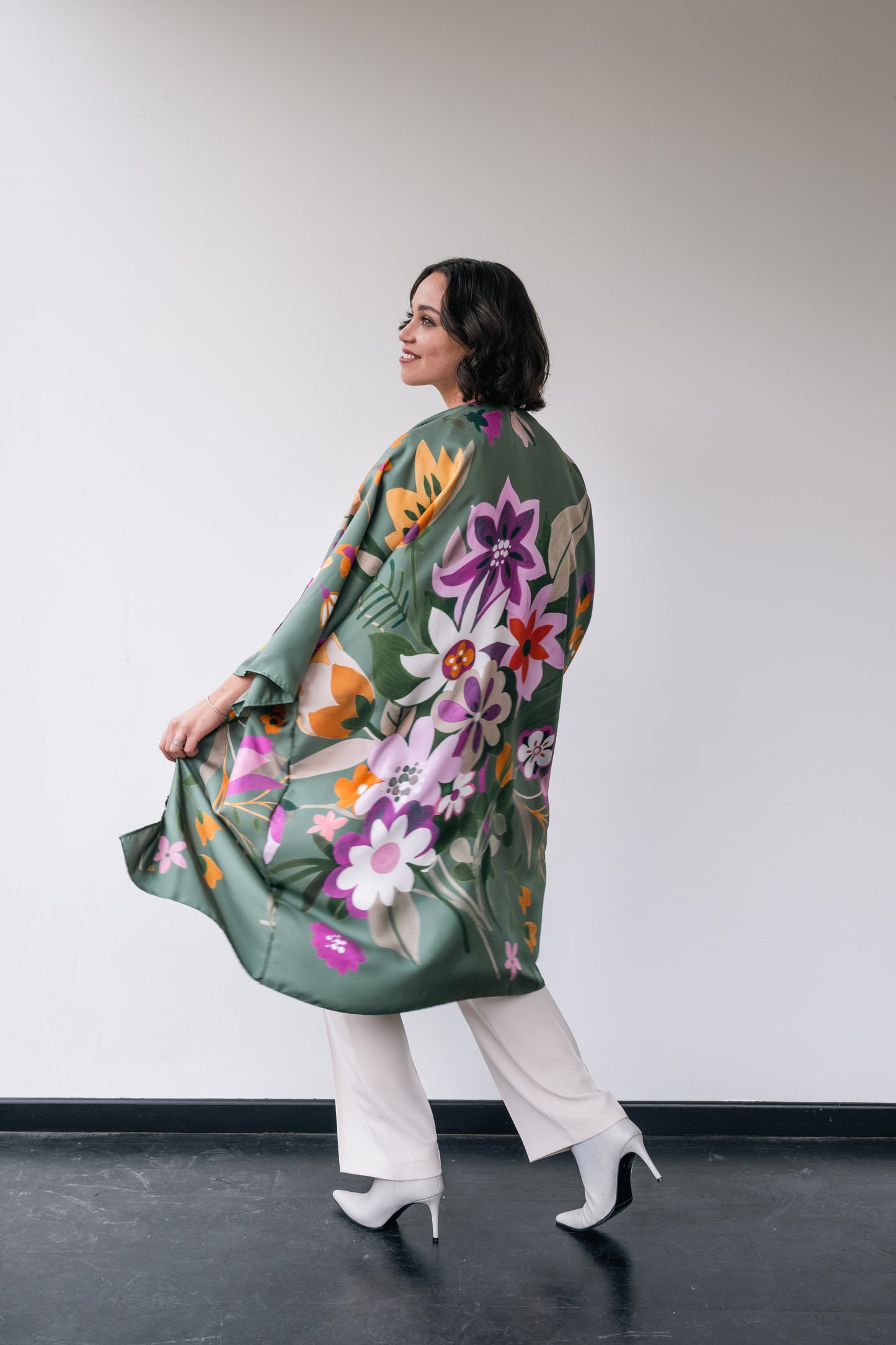 woman wears kaki silk long kimono with flowers.