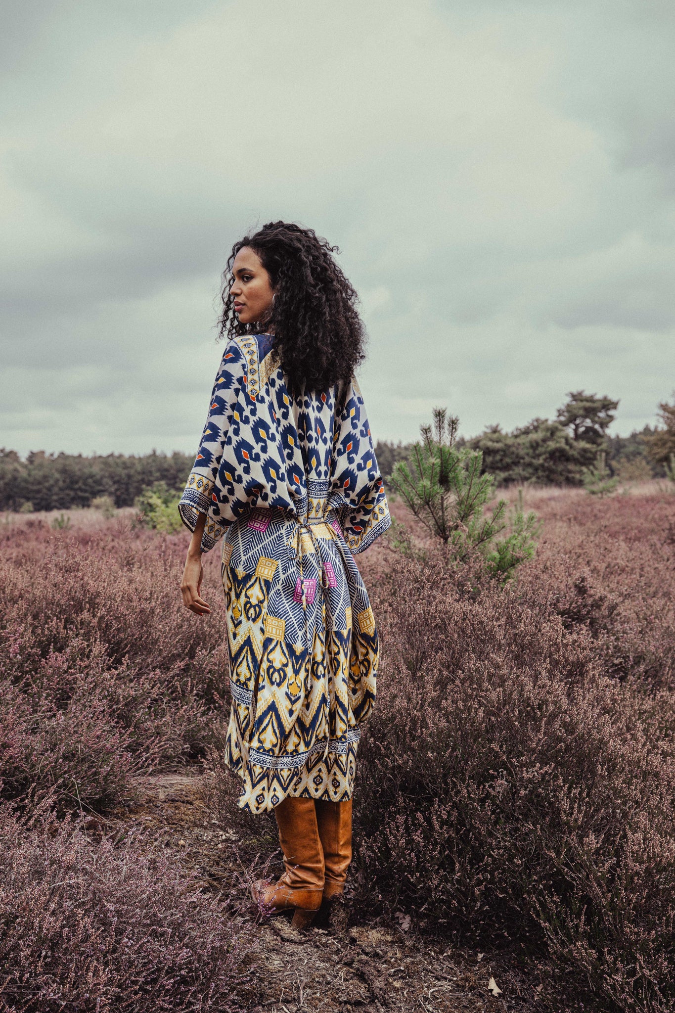 Women wearing a silk dress with a paint stroke design