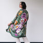 woman wears kaki silk long kimono with flowers. 