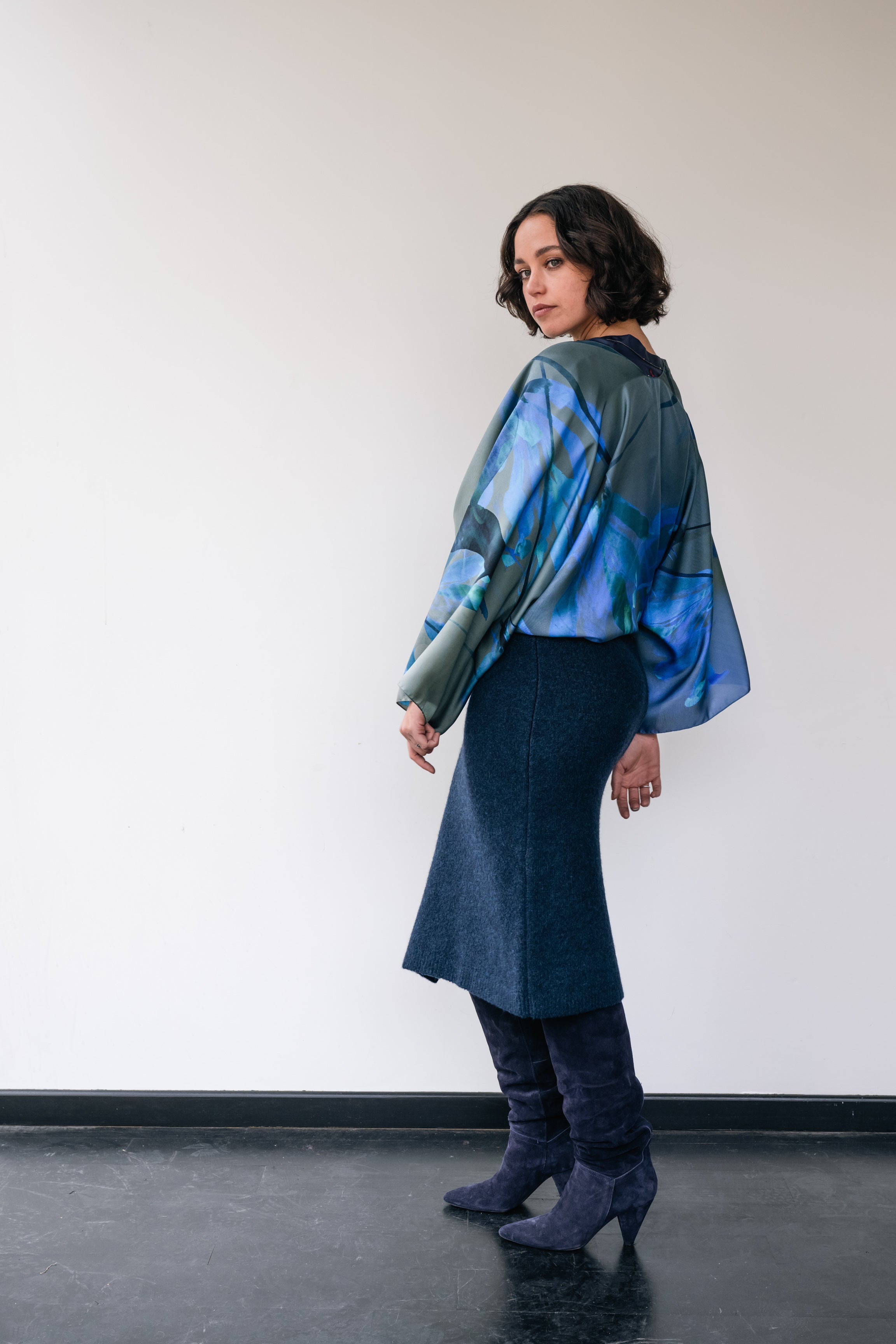 Woman wearing dark blue wool skirt and silk short kimono