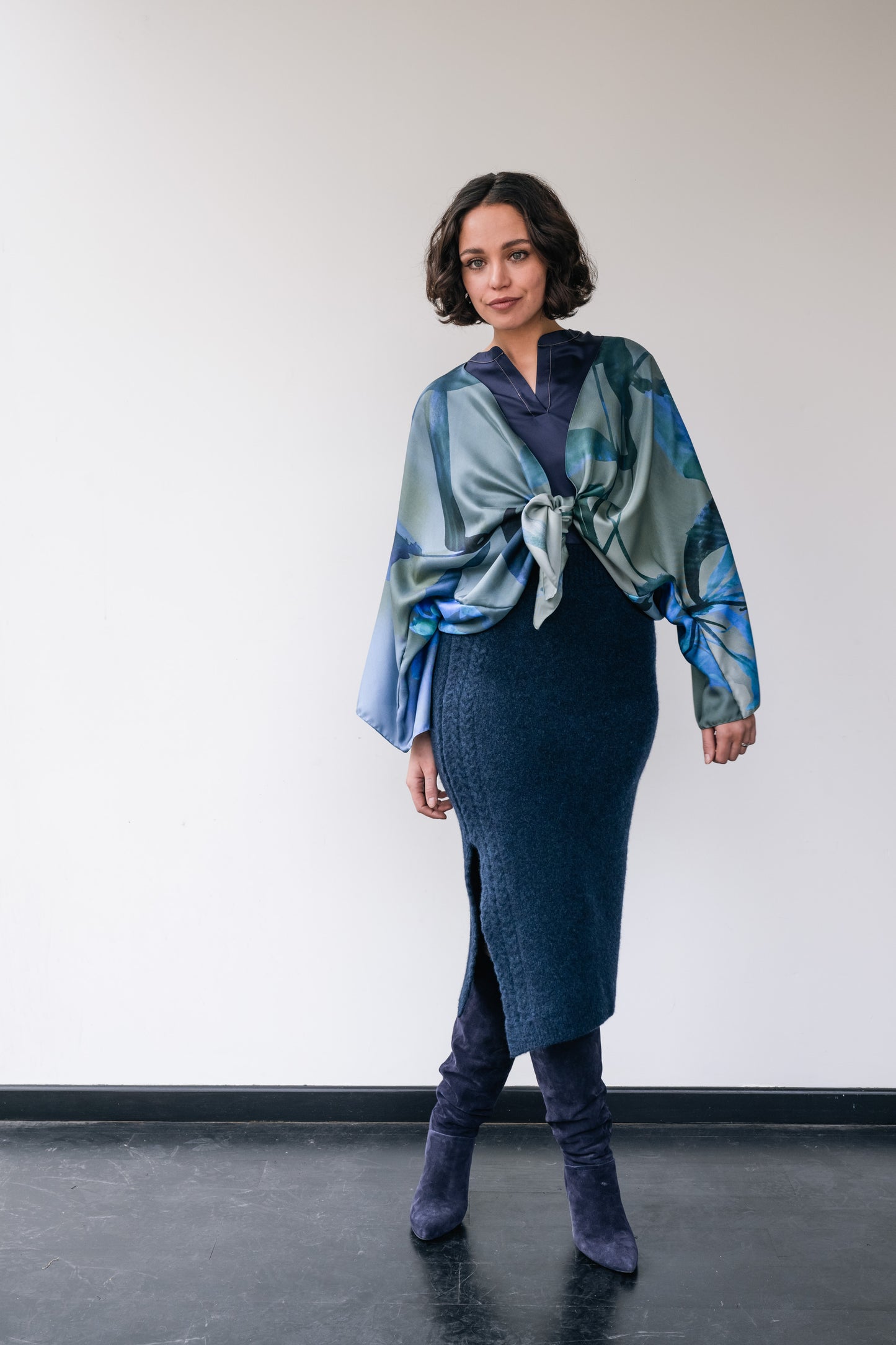 Woman wearing dark blue wool skirt and silk short kimono