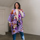 woman wears lilac silk long kimono with flowers. 