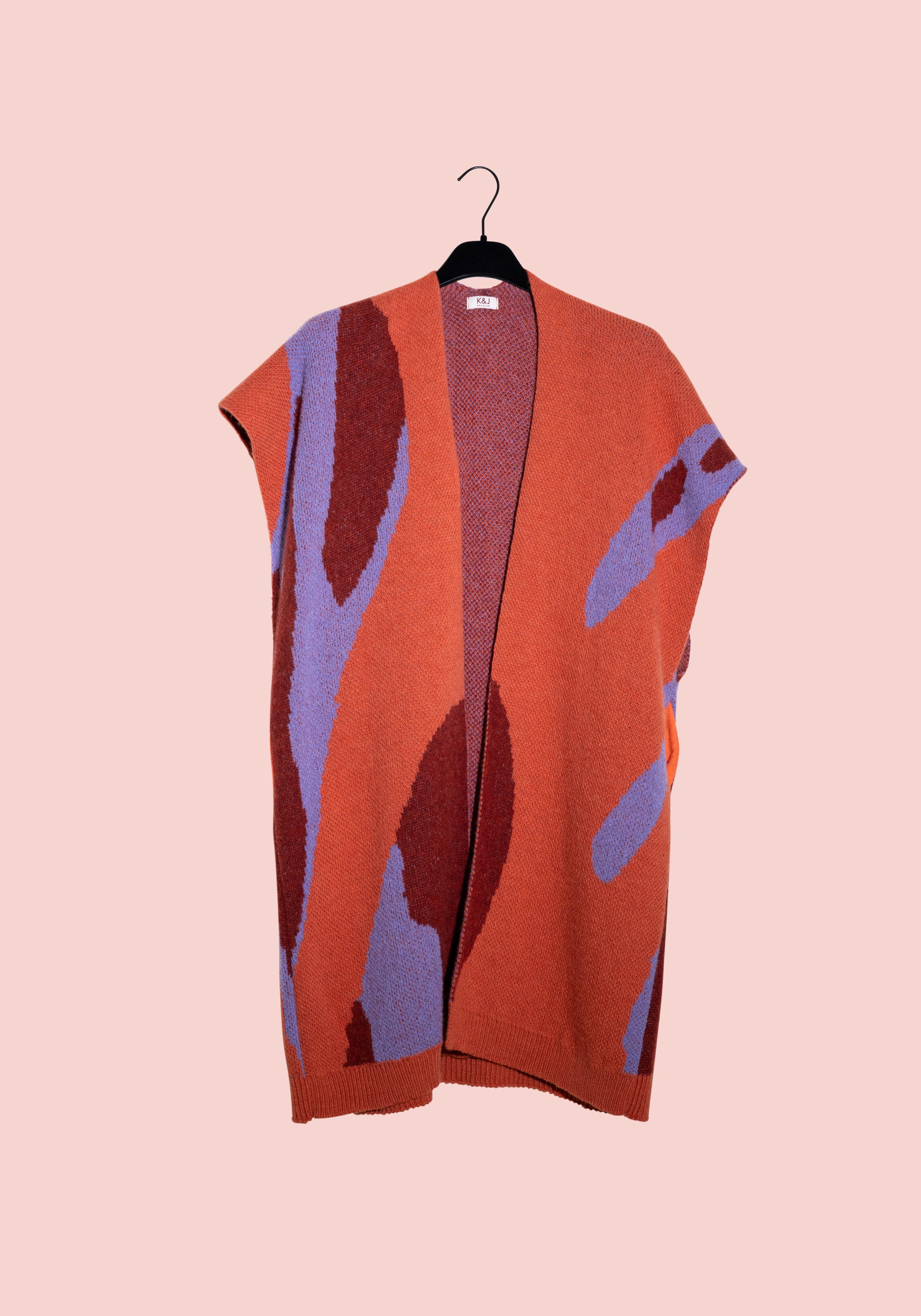 Orange wool vest with lilac shapes